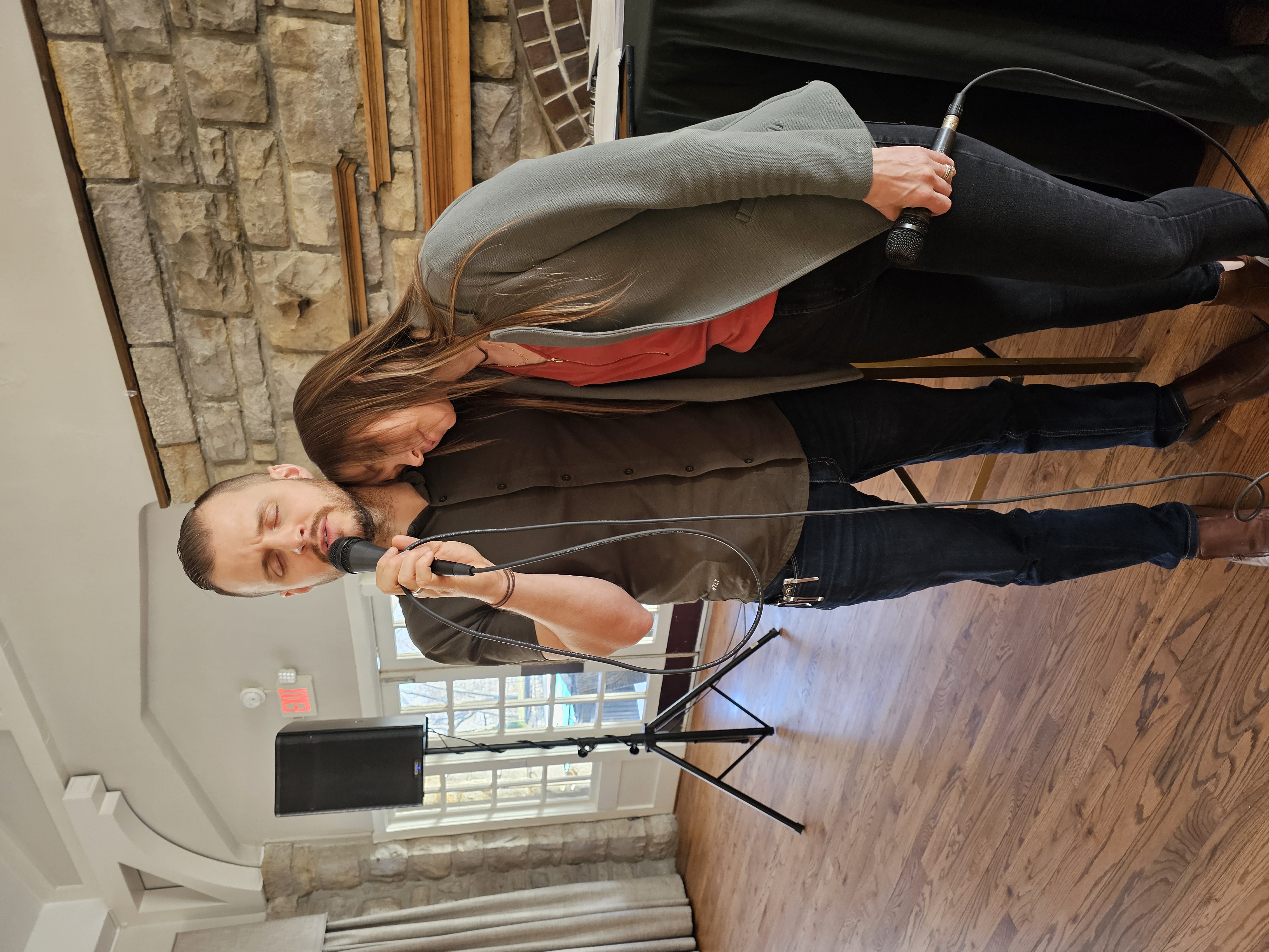 Austin and Rachel Holt in prayer at an event